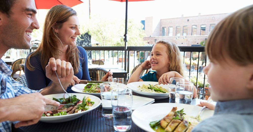 Family eating at a restaurant in Lausanne Web Banner