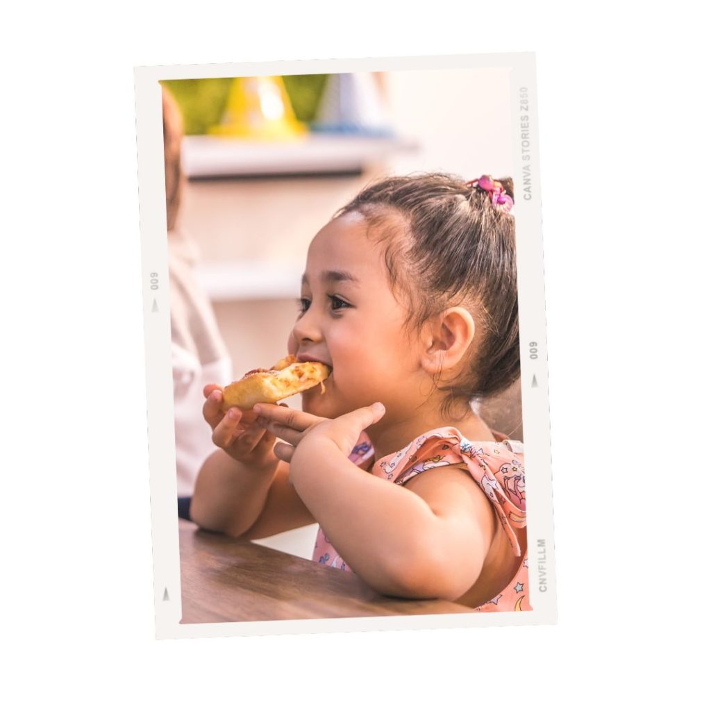 Little girl eating at a restaurant in Courmayeur