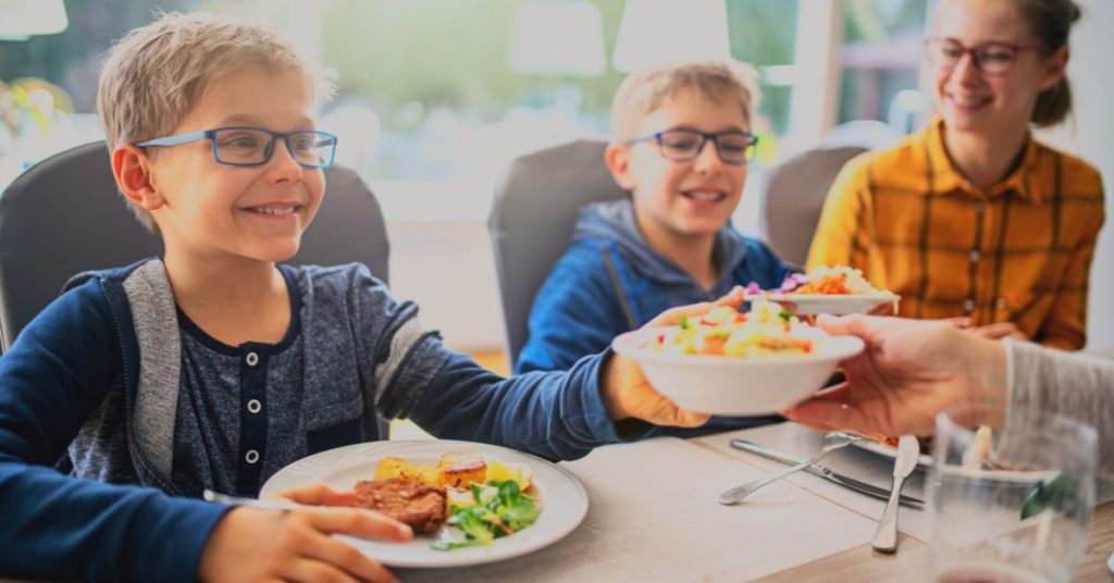 family with kids dining at a restaurant in Stockholm Web Banner