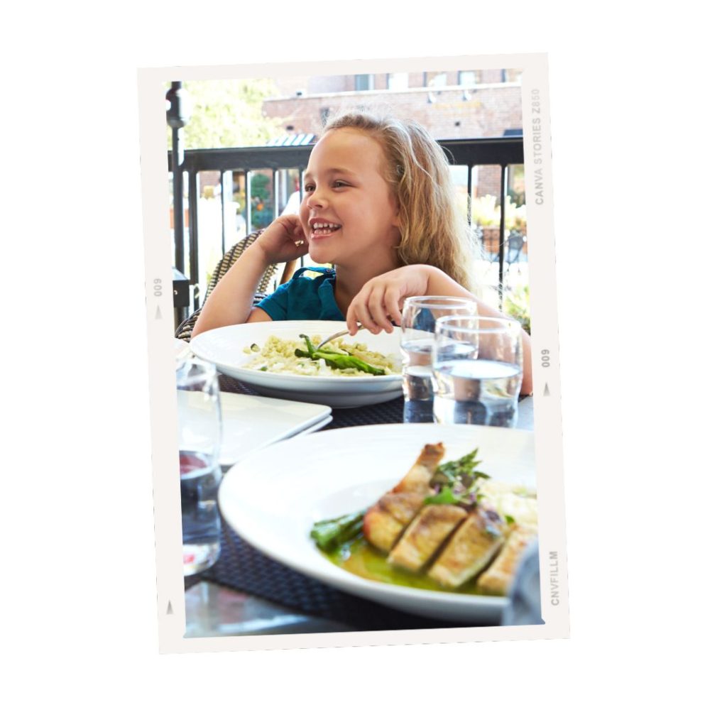 little girl eating at a restaurant in Lausanne.