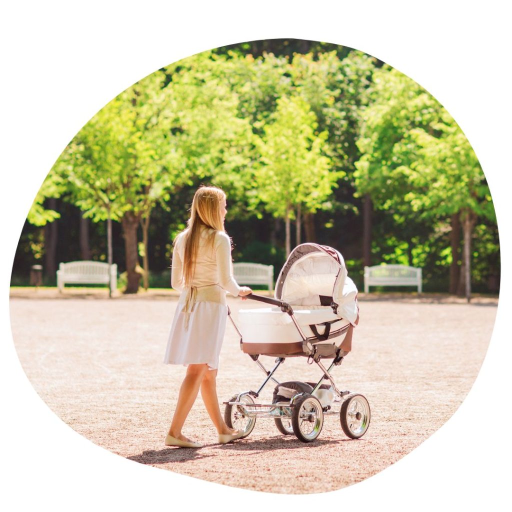 parent travelling with baby in a stroller