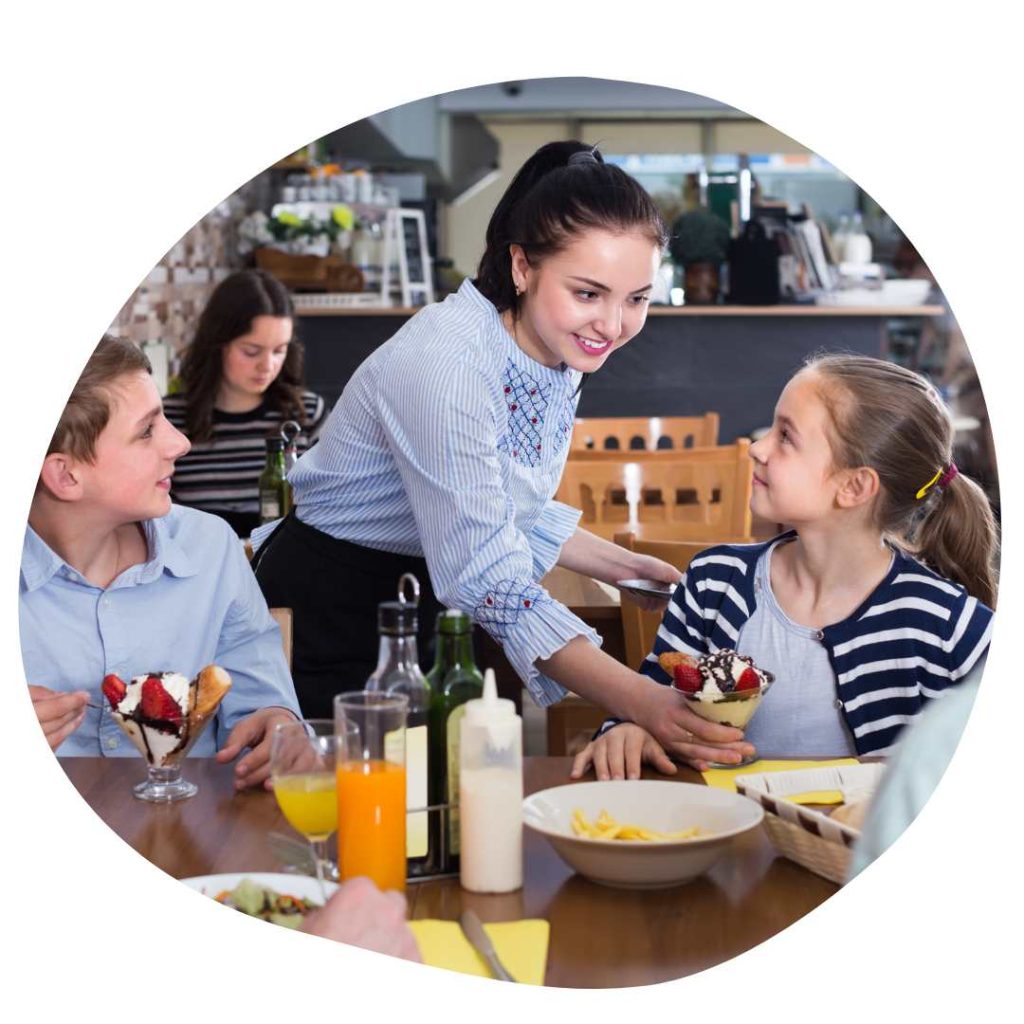 Family at a restaurant, having dessert.