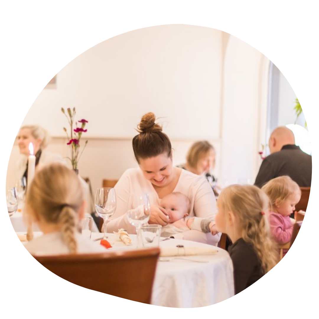 Family at a restuarant with young children and a baby in Tampere