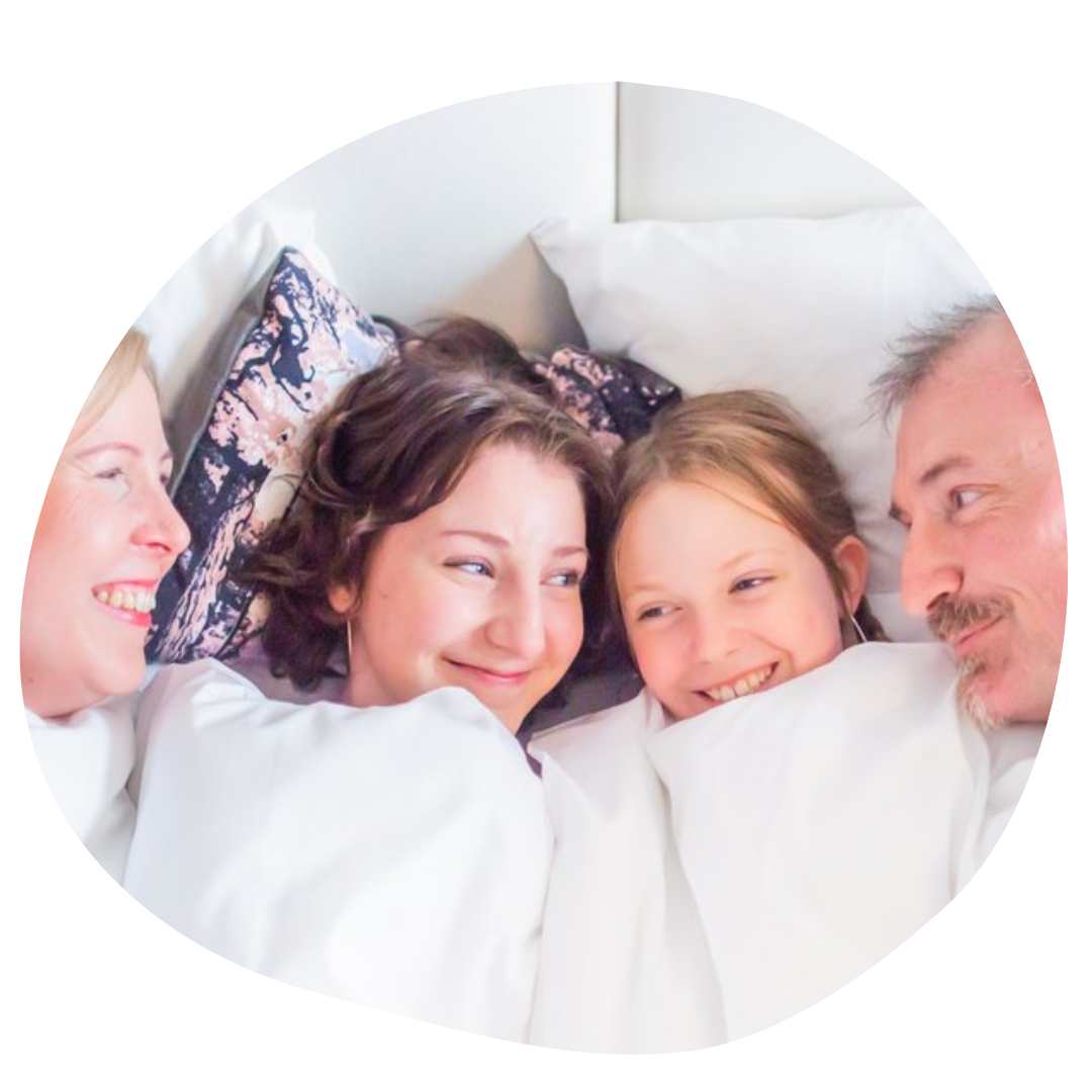 family in a hotel bed in Tampere