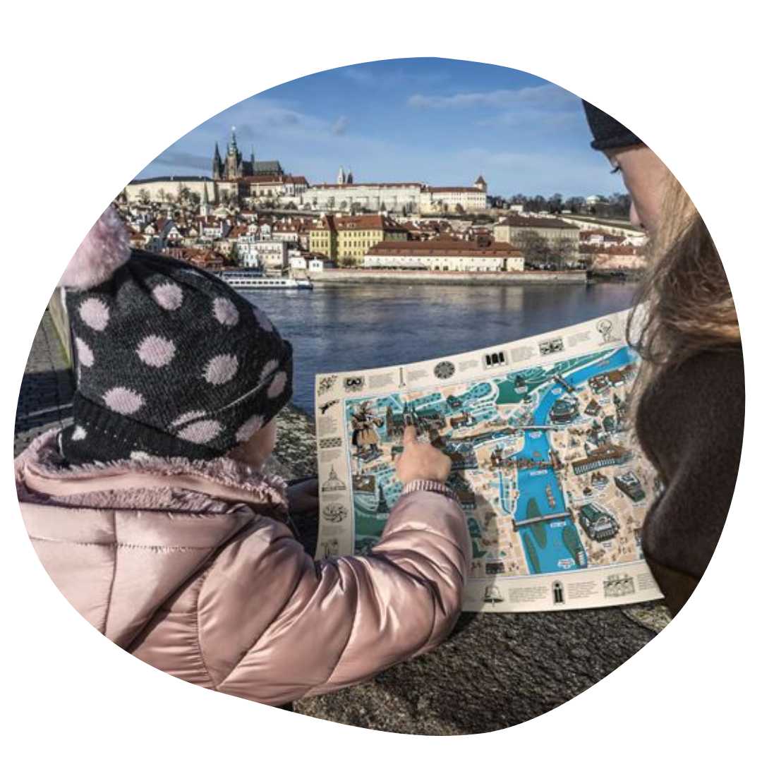mother and daughter looking at map in Prague