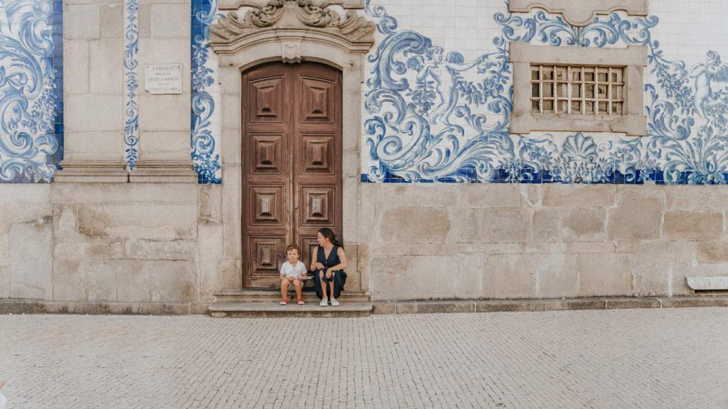 family in Portugal street against a paited background